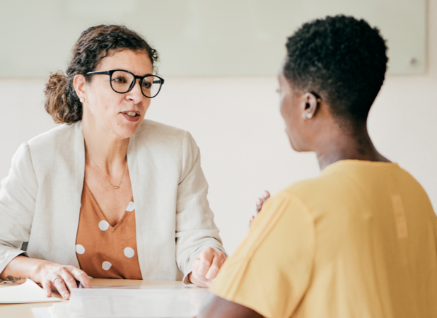 Female manager and employee discussing performance goals